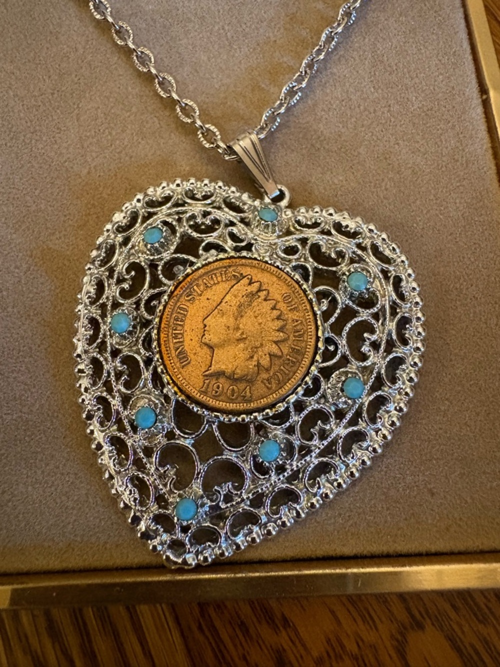Heart 1904 Indian penny in silver plated heart pendant.